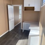 40ft Deluxe Accommodation Container Modules interior bedroom desk corner and door