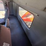 2005 Hino Ranger Tray Back Truck with Crane interior behind seats