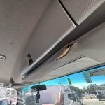 2012 Isuzu FVZ 1000 Tray Back Truck with Hiab interior showing drivers sun visor damage