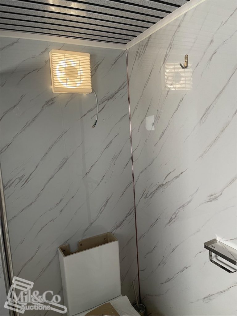 Toilet/Shower Block bathroom wall